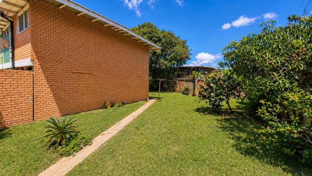 | PRIVATE SALE ● 3-bedroom double-storey flat in Rhodespark ● 350 m off Addis Ababa Road, near Elementos Hotel. ● 500 m² backyard with road frontage onto Mtedza Road. ● Ideal for residential living, offices, or redevelopment extension. Asking Price K3,000 000 slightly negotiable — image 3