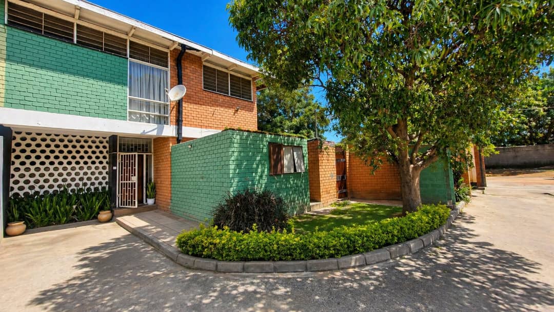 | PRIVATE SALE ● 3-bedroom double-storey flat in Rhodespark ● 350 m off Addis Ababa Road, near Elementos Hotel. ● 500 m² backyard with road frontage onto Mtedza Road. ● Ideal for residential living, offices, or redevelopment extension. Asking Price K3,000 000 slightly negotiable — image 2