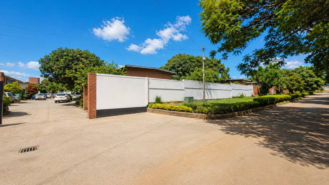 | PRIVATE SALE ● 3-bedroom double-storey flat in Rhodespark ● 350 m off Addis Ababa Road, near Elementos Hotel. ● 500 m² backyard with road frontage onto Mtedza Road. ● Ideal for residential living, offices, or redevelopment extension. Asking Price K3,000 000 slightly negotiable — image 5